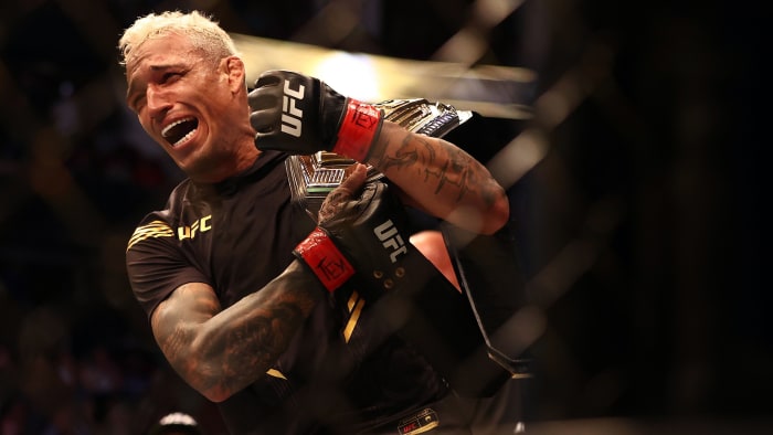 Charles Oliveira reacts following his championship victory against Michael Chandler during UFC 262 at Toyota Center.
